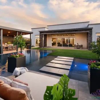 Modern Backyard design with blue pool lights and Jesus steps.