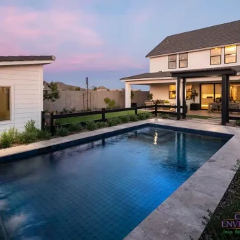 Backyard design with custom trellis and pool with water feature