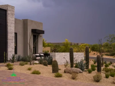 Custom front yard design with organized planting, privacy wall and outdoor seating area.