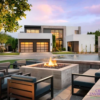 Custom front yard design with artificial turf, fire pit and metal scupper water feature into pond.