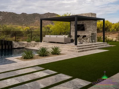 Custom backyard design with slatted metal shade structure, natural stone steps and artificial turf.