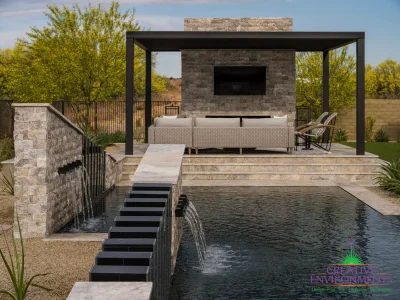 Custom backyard design with multiple angled water features, slatted metal statement piece and desert landscape design.