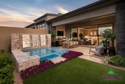 Custom backyard design with acrylic spa, natural stone accents and annuals.