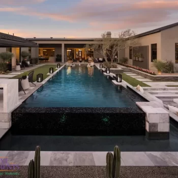 Backyard design with cacti and pool.