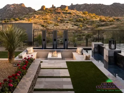 Backyard design with sunken fire feature and natural stone steps.