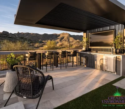 Backyard design with cantilevered shade structure and multiple seating areas.