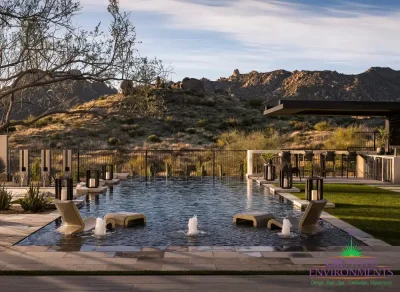 Backyard design with scupper and bubbler water features and baja step.