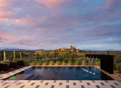 Custom backyard design with deco-tile decking, metal scupper water feature into pool and large planters.