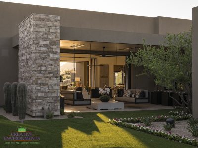 Custom front yard design with hanging beds, cacti and artificial turf.