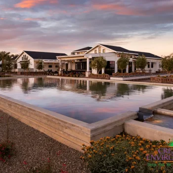 Custom community amenities with large water feature, clubhouse and multiple seating areas.