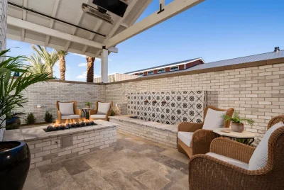 Custom community amenities with deco-tile water feature, fire pit and outdoor heaters.