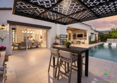 Custom backyard design with cantilevered metal shade structure that doubles as metal statement piece.