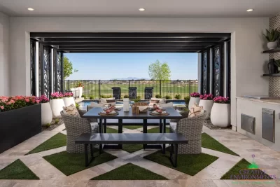 Custom backyard design with metal statement piece, artificial turf pattern and large planters.