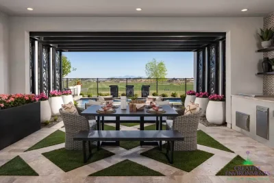 Custom backyard design with metal statement piece, artificial turf pattern and large planters.