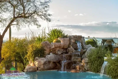 Backyard design with natural rock water fall.