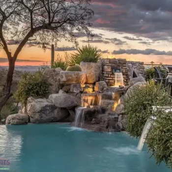 Backyard design with cacti and natural stone water fountain