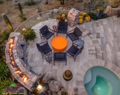 Backyard design with circular spa and top fire feature.