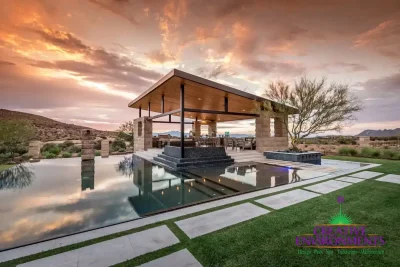 Custom backyard design with baja step in pool and angled shade structure next to pool.