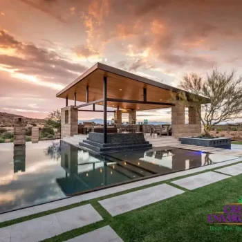 Custom backyard design with baja step in pool and angled shade structure next to pool.