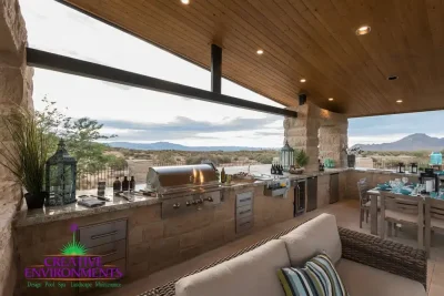 Custom shade structure with outdoor kitchen complete with outdoor BBQ, outdoor storage and multiple seating areas.