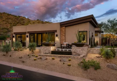 Custom front yard design with water fountain, wok planters and desert contemporary vibes.