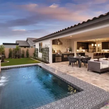 Custom backyard design with deco-tile pool, metal trellis and outdoor kitchen.