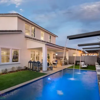 Backyard design with cantilevered water scuppers into pool