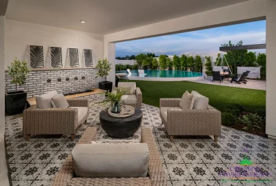 Custom backyard design with deco-tile patio, multiple seating areas and large metal planters.