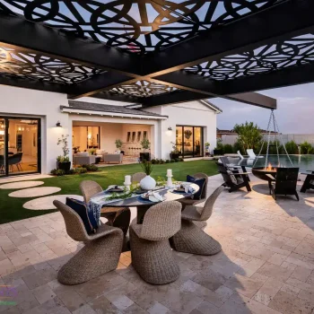 Customized backyard design with patterned metal shade structure, multiple seating areas and cantilevered wok fire pit.