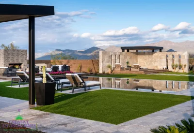 Custom backyard design with cantilevered outdoor shower, angled shade structure and artificial turf.