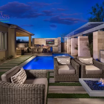 Custom backyard design with rain curtain water feature, cantilevered fire table and multiple seating areas.